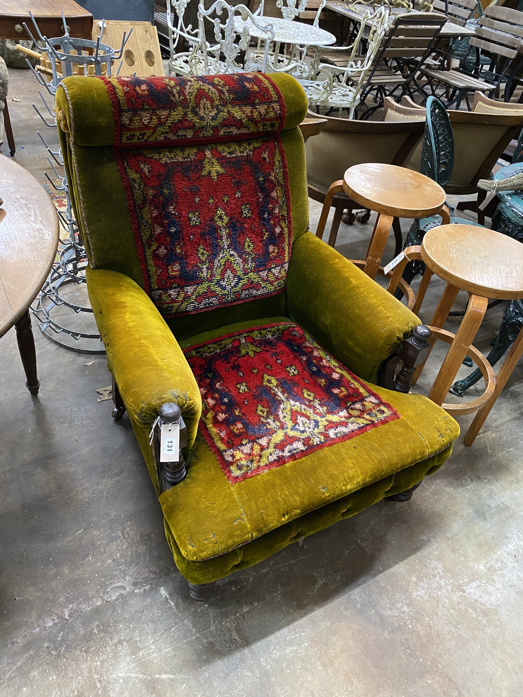 A late Victorian carpet upholstered armchair, bears Dublin maker's plaque, width 78cm, depth 90cm, height 94cm